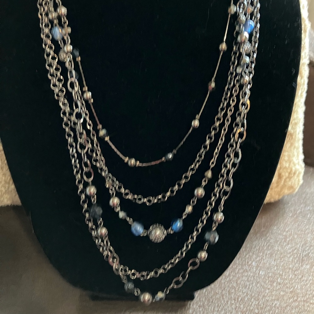 Multi layered necklace with brushed silver tone